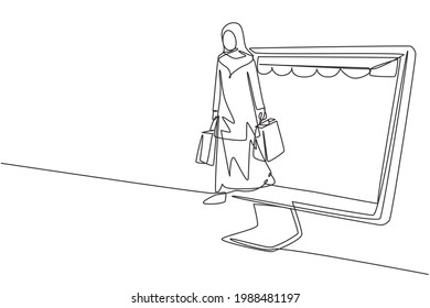 Single Continuous Line Drawing Arab Woman Coming Out Of Canopy Monitor Screen Holding Shopping Bags. Digital Lifestyle And Consumerism Concept. Dynamic One Line Draw Graphic Design Vector Illustration