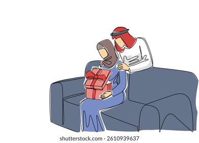 Single continuous line drawing an arab woman sitting on the sofa while opening a gift box. Opening a surprise gift from the beloved partner. Present. Surprise. One line design vector illustration