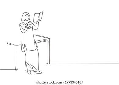 Single continuous line drawing Arabian woman reading, learning and standing around table. Study in library. Smart student, education concept. Dynamic one line draw graphic design vector illustration