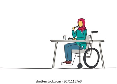 Single continuous line drawing Arabian female young wheelchair user eating food sitting at the table. Having lunch, snack in cafe. Society and disabled people. One line draw design vector illustration