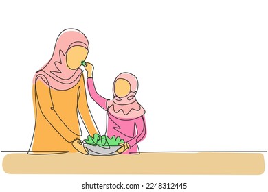 Single continuous line drawing Arabian mother feeds her daughter food and in front of her is bowl filled with salad. Cooking together in cozy kitchen. One line draw graphic design vector illustration