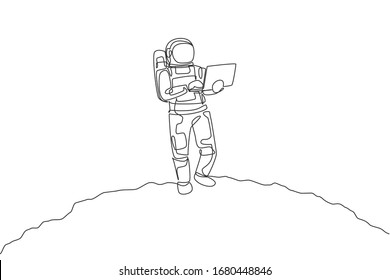 Single continuous line drawing of astronaut standing in moon surface while typing using laptop. Business office with galaxy outer space concept. Trendy one line draw design graphic vector illustration