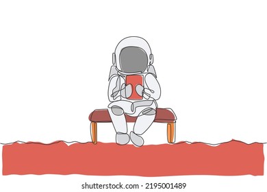 Single continuous line drawing of astronaut siting relax on chair while reading news in tablet phone. Business office with galaxy outer space concept. Trendy one line draw design vector illustration