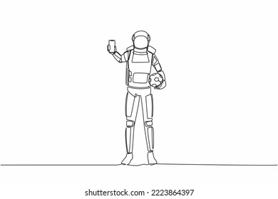 Single continuous line drawing astronaut soccer player holding football ball and smartphone. Mobile football soccer. Mobile sport play match. Cosmonaut deep space. One line design vector illustration