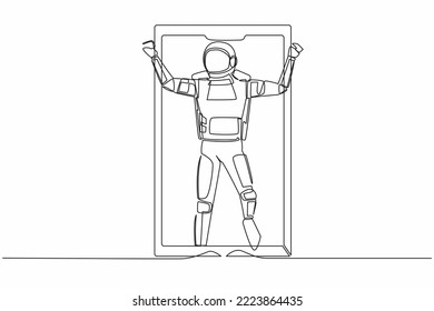 Single continuous line drawing astronaut football player celebrating goal out of smartphone screen. Online soccer game with live mobile app. Cosmonaut deep space. One line design vector illustration