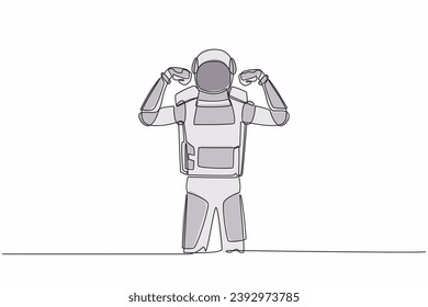 Single continuous line drawing astronaut standing with gestures two hand fist up. Strong spaceman exploration galaxy with spaceship. Cosmonaut deep space. One line graphic design vector illustration