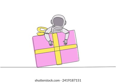 Single continuous line drawing astronaut hugging gift box. Gift box with ribbon has been prepared by the expedition crew. Ready to give to team on earth. Cosmic. One line design vector illustration