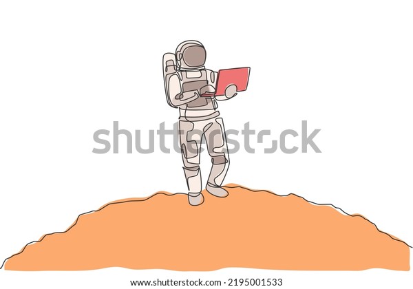 Single continuous line drawing of astronaut\
standing in moon surface while typing using laptop. Business office\
with galaxy outer space concept. Trendy one line draw design\
graphic vector\
illustration