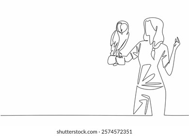 Single continuous line drawing barn owl perched on hand of woman. This animal has very sharp hearing. Hunter of the night who flies silently. Woman Holding Bird. One line design vector illustration