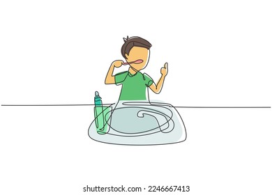Single continuous line drawing boy brushing his teeth with thumbs up gesture. Routine habits for cleanliness, health, freshness of mouth and teeth. One line draw graphic design vector illustration