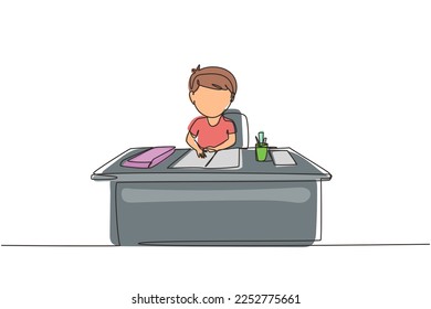 Single continuous line drawing boy studying on table with stationery such as books, pencils, pens. Kid makes homework from school. Intelligent student. One line draw graphic design vector illustration