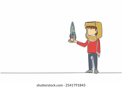 Cuerpo de dibujo de línea continua única que sostiene un cohete de cartón con un casco de cartón. Parecido al astronauta. Sueños que deben hacerse realidad. Grandes sueños. Día de la Cosmonáutica. Ilustración vectorial de diseño de una línea