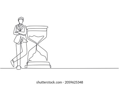 Single continuous line drawing businessman lean huge giant hourglass for time is money financial investment concept  Time management conceptual metaphor  One line draw design vector illustration