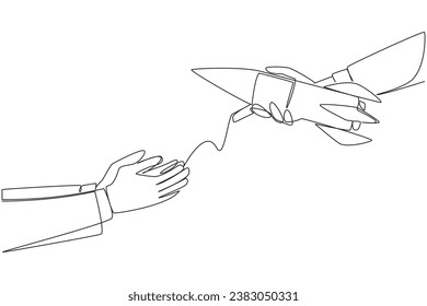 Single continuous line drawing a businessman's hand gives rocket to colleague. Put full trust in managing overseas business branches. Trust will produce results. One line design vector illustration
