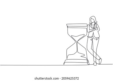 Single continuous line drawing businesswoman lean huge giant hourglass  Time is money financial investment concept  Time management conceptual metaphor  One line draw design vector illustration