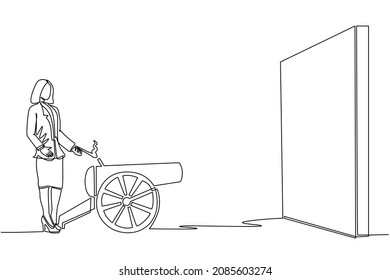 Single continuous line drawing businesswoman ignites cannon in front of wall and want to destroy. Starting new business company by destroying obstacles to reach goal. One line graphic design vector
