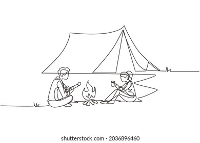 Single continuous line drawing camping couple around campfire tents. Man playing guitar and woman drinking hot tea getting warm near bonfire sitting on ground. One line draw design vector illustration