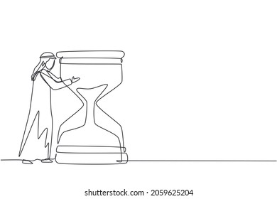 Single continuous line drawing confident young Arabian businessman hugging on huge hourglass. Time management or successfully task organizing concept. One line draw graphic design vector illustration