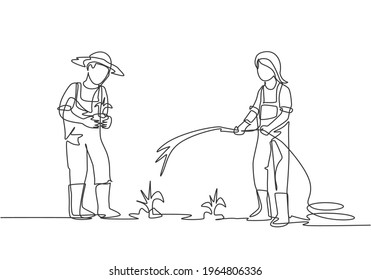 Single continuous line drawing couple farmer watering the plants using a hose and planting new plants. Farmer planting activities concept. Dynamic one line draw graphic design vector illustration.