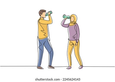 Single continuous line drawing couple of Arabian teenagers standing while enjoying a bottle of fresh water after exercise together. Healthy lifestyle. One line draw graphic design vector illustration