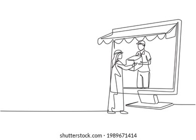 Single continuous line drawing courier comes out of giant monitor screen with canopy and gives package box to Arabic male customer. Online delivery. One line draw graphic design vector illustration