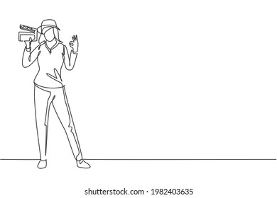 Single Continuous Line Drawing Female Film Director Stands With Gesture Okay Holding Clapperboard And Prepare Camera Crew For Shooting At Studio. One Line Draw Graphic Design Vector Illustration