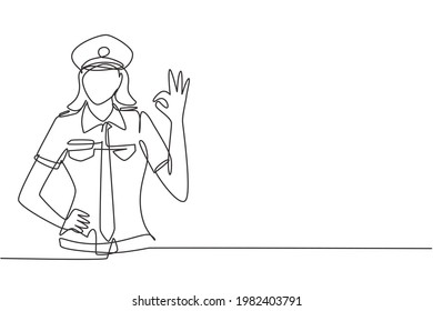 Single continuous line drawing female pilot with gesture okay and uniform ready to fly with cabin crew in aircraft at international airport. Dynamic one line draw graphic design vector illustration