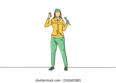 Single continuous line drawing female mechanic stands up with gesture okay and holding wrench to perform maintenance on vehicle engine. Success work. One line draw graphic design vector illustration