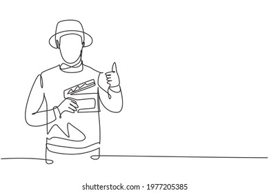 Single continuous line drawing the film director with a thumbs-up gesture while holding the clapperboard set the crew for studio shooting. Dynamic one line draw graphic design vector illustration.