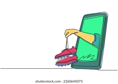 Single continuous line drawing football shoes in hand coming out from smartphone screen. Mobile football soccer. Mobile sports play match. Online soccer game. One line draw design vector illustration