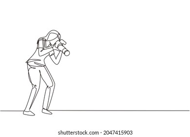 Single continuous line drawing funny professional woman photographer with camera taking photo with pose. Photographer female character with camera digital. One line draw design vector illustration