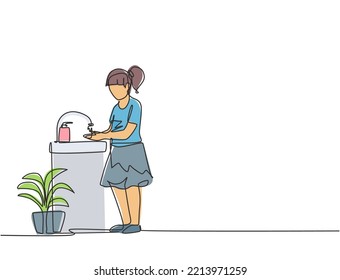 Single continuous line drawing a girl washes her hands in the sink, there is a soap dish by the tap and there is a pot of plants under the sink. One line draw graphic design vector illustration.