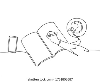 Single continuous line drawing of hand gesture writing on an open book beside a cup of coffee and smartphone. Writing draft business concept. Modern one line draw design graphic vector illustration