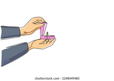 Single continuous line drawing hand holding red velvet box for ring. Groom's gift for bride on their special day. Marriage ceremony celebration. Dynamic one line graphic design vector illustration