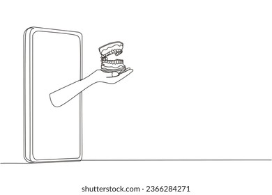Single continuous line drawing hand comes out from the smartphone holding dentures. Special application about oral health and its anatomy. Online consultation. One line design vector illustration