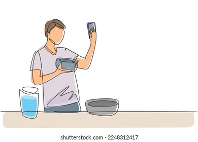 Single continuous line drawing handsome male taking selfie or making video call using her smartphone while cooking fresh salad. Healthy food concept. One line draw graphic design vector illustration