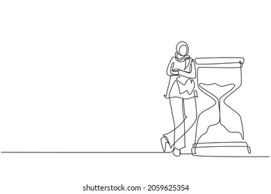 Single continuous line drawing happy Arab businesswoman lean huge giant hourglass  Time is money financial investment  Time management conceptual metaphor  One line draw design vector illustration