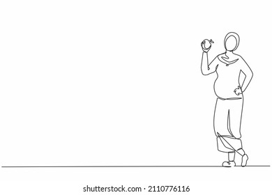 Single continuous line drawing happy beautiful Arabian pregnant woman holding apple. Pregnancy and motherhood concept eating healthy fresh fruit food. One line draw graphic design vector illustration