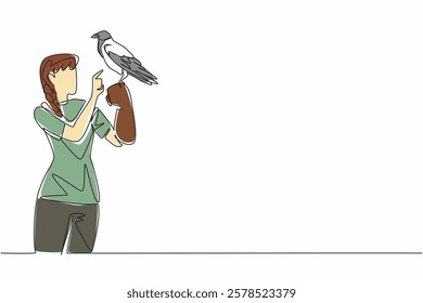 Single continuous line drawing hooded crow perched on hand of woman. This animal does not look so pretty but it is very intelligent. Mysterious. Woman Holding Bird. One line design vector illustration