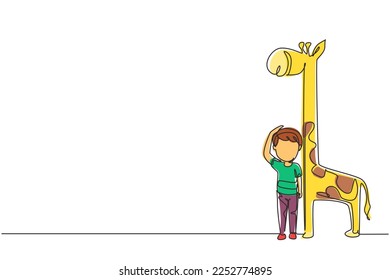 Single continuous line drawing little boy measuring his height with giraffe height chart on wall. Kid measures growth. Child measuring height. Dynamic one line draw graphic design vector illustration