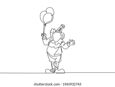 Single continuous line drawing 
the male clown stands while holding several balloons in his right hand. Children really like the show. Dynamic one line draw graphic design vector illustration.