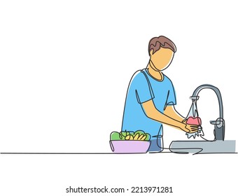 Single continuous line drawing a man washes fruits in the sink from the germs that stick to clean. Cleaned with water to make it hygienic. Dynamic one line draw graphic design vector illustration.