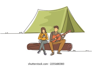 Single continuous line drawing man woman sing song at campsite. Girl drinking tea and guy playing guitar, sitting on logs. Romantic couple dating on camping. One line draw design vector illustration