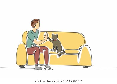 Single continuous line drawing man sitting on sofa with his cat while giving high five. Educated to be an obedient animal. Favorite pet. Bonding. National Pet Day. One line design vector illustration