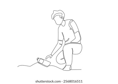 Single continuous line drawing of a man who is picking up trash in a public place.One line draw graphic design vector illustration
