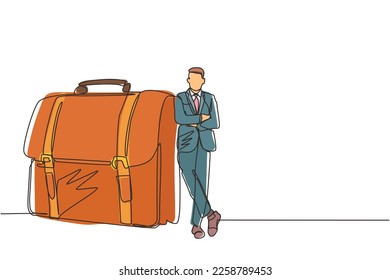 Single continuous line drawing modern confident male entrepreneur leaning on large briefcase. Happy businessman standing with elegance pose. Dynamic one line draw graphic design vector illustration