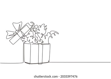 Single continuous line drawing opened gift box with confetti. Present package with bursting element, surprise inside, celebration event, presents, birthday. Dynamic one line draw graphic design vector