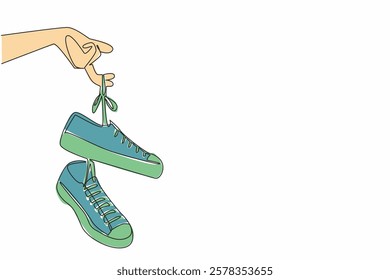 Single continuous line drawing a pair of sneakers with laces hanging from the fingers. Easy to carry. Attracts attention. National Two Different Colored Shoes Day. One line design vector illustration