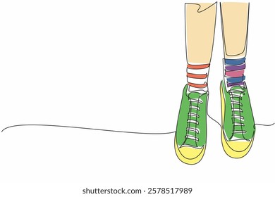 Single continuous line drawing pair of feet wearing socks with different stripes on the right and left. Everyone has the right to wear anything. Anti Bullying Day. One line design vector illustration