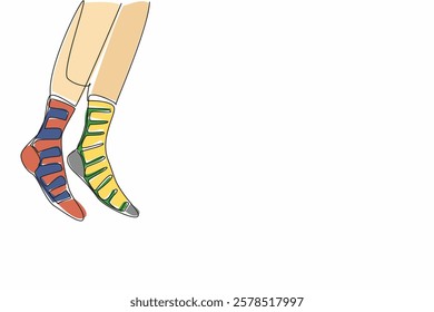 Single continuous line drawing a pair of feet wearing socks with different stripes on the right and left. Walk freely with confidence. Freedom. Anti Bullying Day. One line design vector illustration